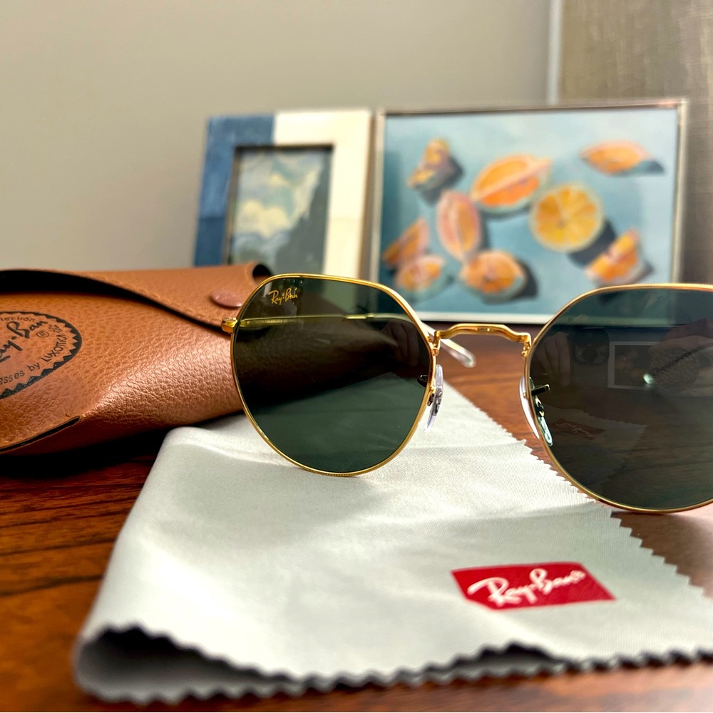 Green and gold round Ray-Bans.
